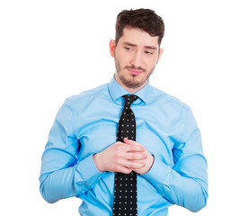 Shame. Embarrassed young man, avoiding eye contact