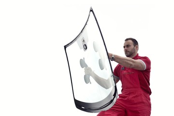 mechanic holding windshield