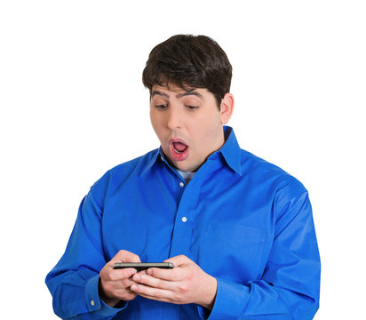 Shocked  man receiving bad news on cell phone