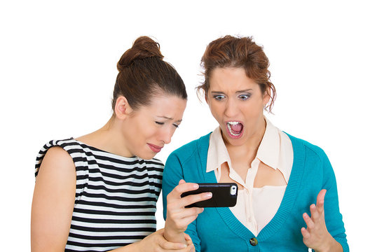 Upset women receiving bad news on mobile cell phone