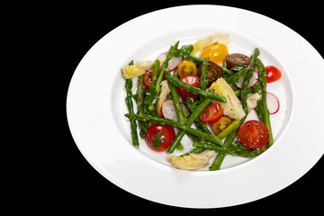 Delicious Fresh salad with asparagus, artichoke and tomatos