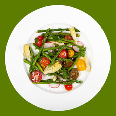 Delicious Fresh salad with asparagus, artichoke and tomatos