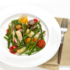Vegetable salad with asparagus and tomato