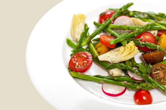 Delicious Fresh salad with asparagus, artichoke and tomatos