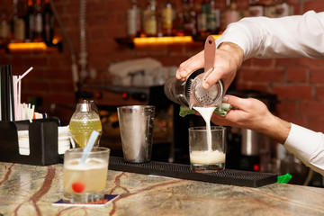 Bartender is making a cocktail
