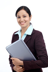 Happy young business woman with tablet computer