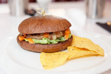 Hamburger with chips in a fast food restaurant