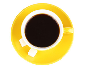 Yellow cup and saucer isolated on white
