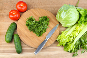 Heart shape of chopped herbs  and fresh vegetables,