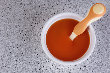 Baby food and milk on table