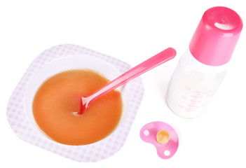 Baby food and milk isolated on white
