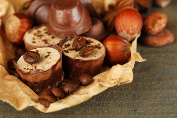 Tasty chocolate candies with coffee beans and nuts