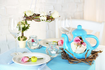 Beautiful holiday Easter table setting in blue tones,