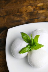 Tasty mozzarella cheese with basil