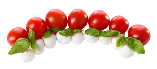 Tasty mozzarella cheese balls with basil and red tomatoes,