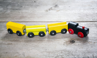 Toy train in wooden background