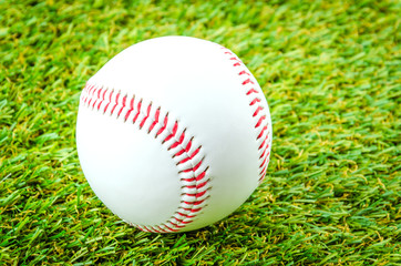 Baseball on green grass