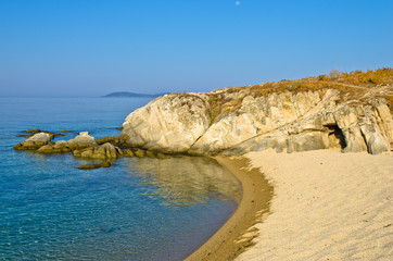 Beach with a small cave  at sunrise, Sithonia