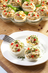 stuffed eggs with ham, red pepper and dill