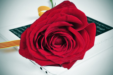 red rose and e-book, for Saint Georges Day in Catalonia, Spain