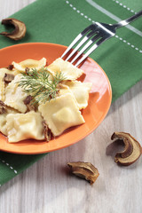 Portion of ravioli with mushrooms and sauerkraut