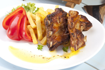 Grilled ribs on plate
