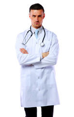 Confident male doctor standing with closed eyes 