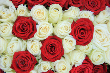 Red and white roses in a wedding arrangement