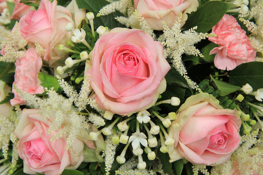 Pink roses and stephanotis in bridal bouquet