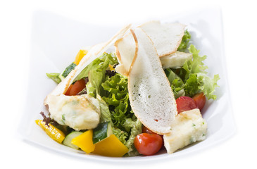 salad of meat cheese and vegetables in a restaurant