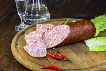 sausage on a wooden plate in a restaurant