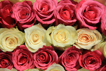 Pink roses in different shades in wedding arrangement