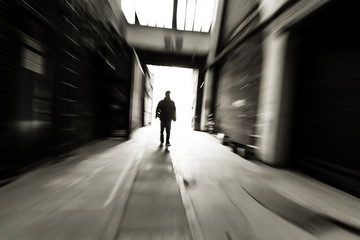 people through doorway at a factory building,motion blur