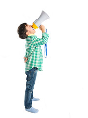 Kid shouting by megaphone over white background