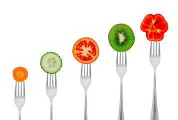 Dietary concept, vegetables and fruit on a fork