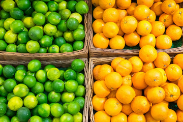 Limes and oranges for sale at a market