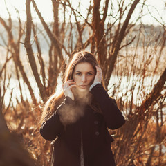 beautiful hipster girl in cold spring morning