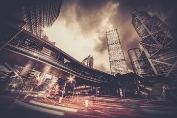 Foto op Plexiglas Fast moving cars at night in modern city © Nejron Photo
