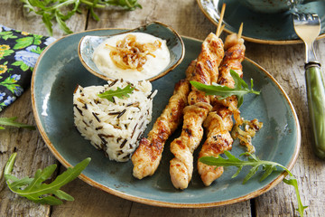 Barbecue beef skewers with sauce.