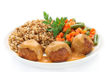 Pork meatballs with sauce, buckwheat, green beans and carrots