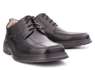 Black glossy man’s shoes with shoelaces