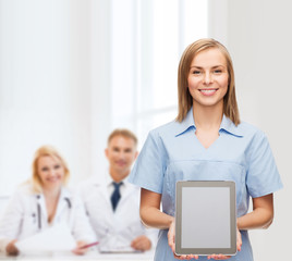 smiling female doctor or nurse with tablet pc