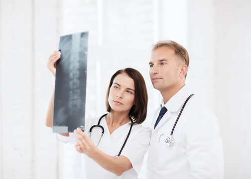 two doctors looking at x-ray