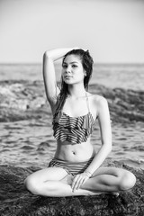 Fototapeta na wymiar monochrome shot of beautiful woman in bikini on the beach