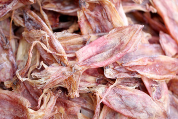 Drying squid in preservation of foods.