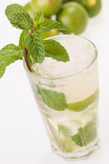 Mojito cocktail with limes close up top view