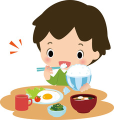 朝ごはんを食べる男の子