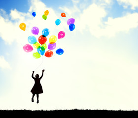 Obraz na płótnie Canvas Little Girl in the Air Holding Balloons