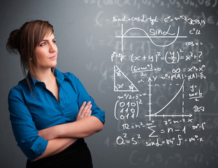 Beautiful school girl thinking about complex mathematical signs