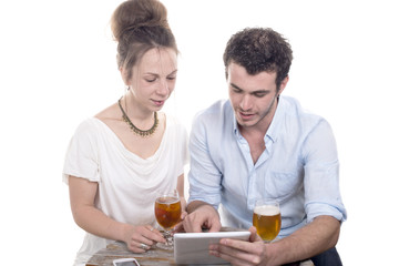 young couple playing with a digital tablet